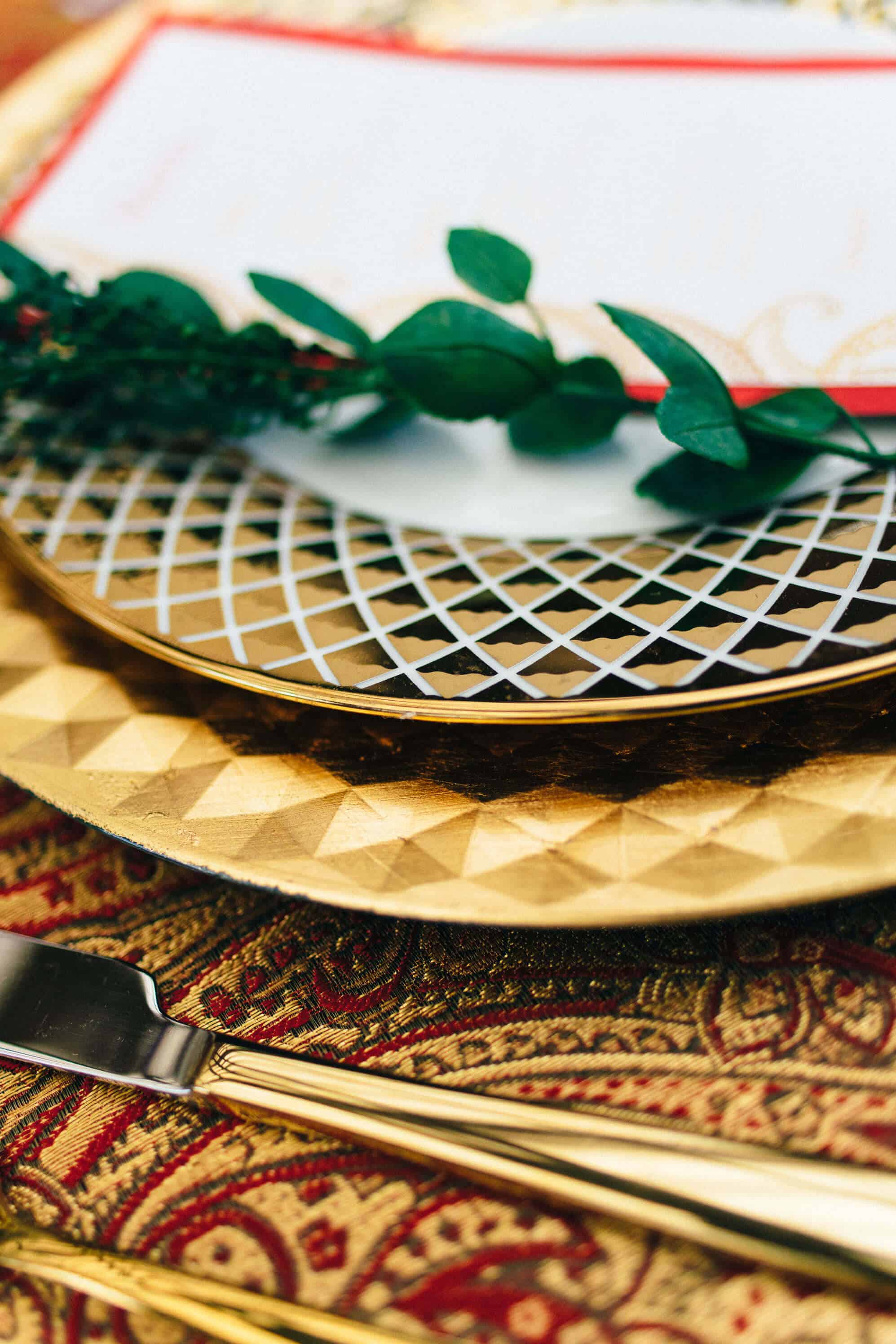 A close up of plates and forks on a table